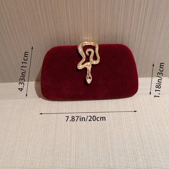 Elegant Burgundy Clutch with Gold Accent
